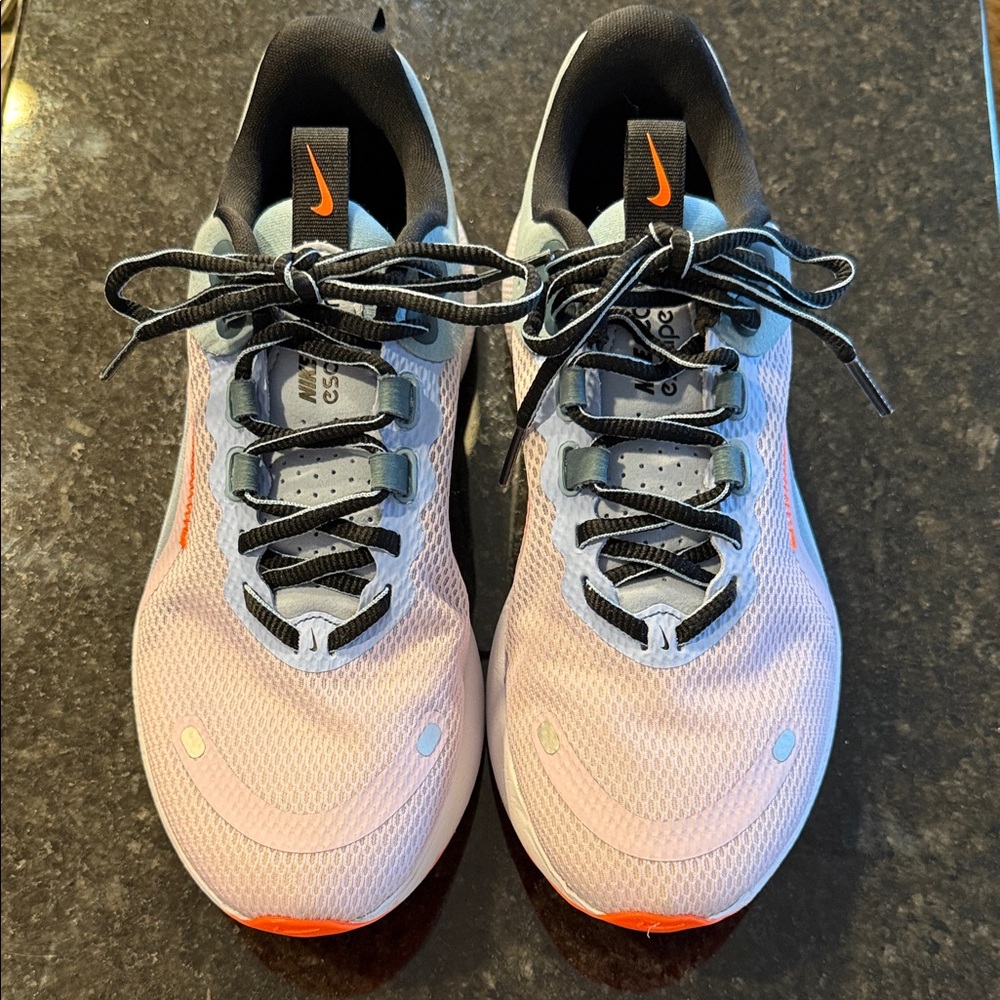 Nike React escape rn running shoes in lavender, light blue, orange and black.